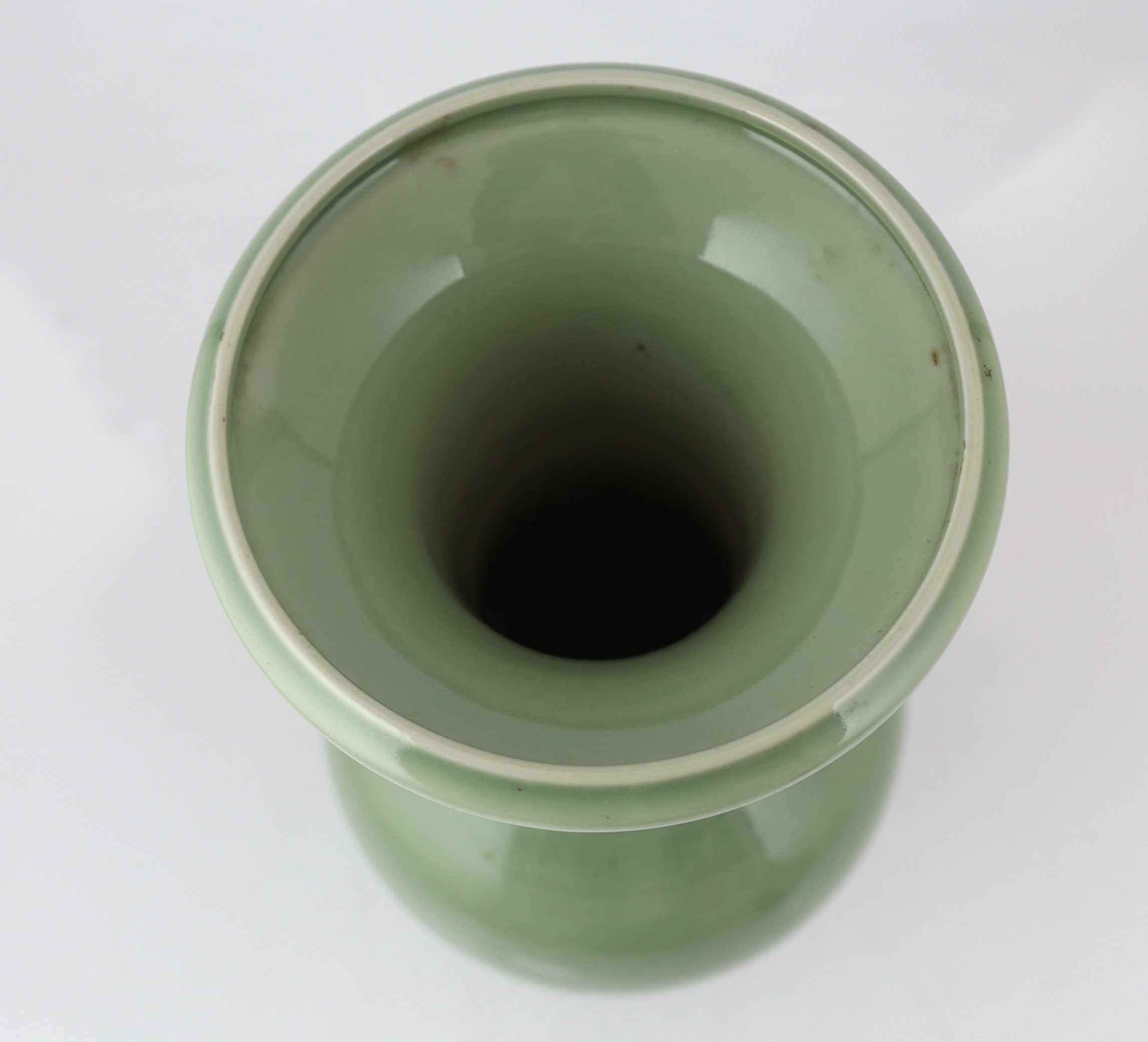 A Chinese carved celadon glazed yen-yen vase, 19th century, base drilled